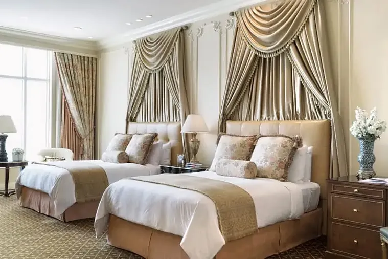 Two queen beds in a Venetian penthouse suite