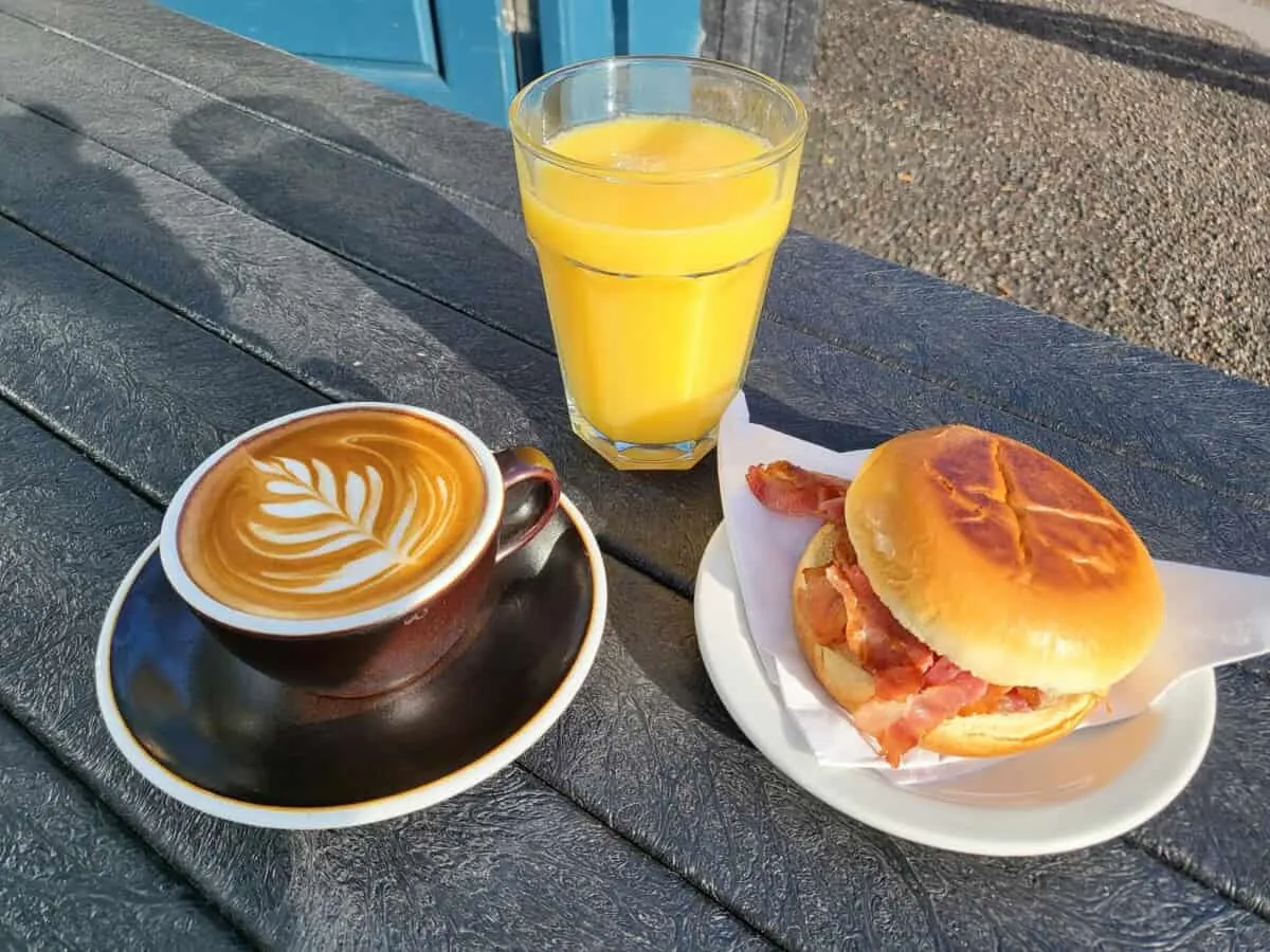 Bacon Brioche Bun, Flat White, Fresh Orange.