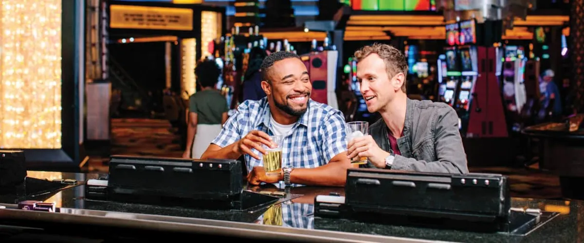 Two guys having drinks at Extra bar