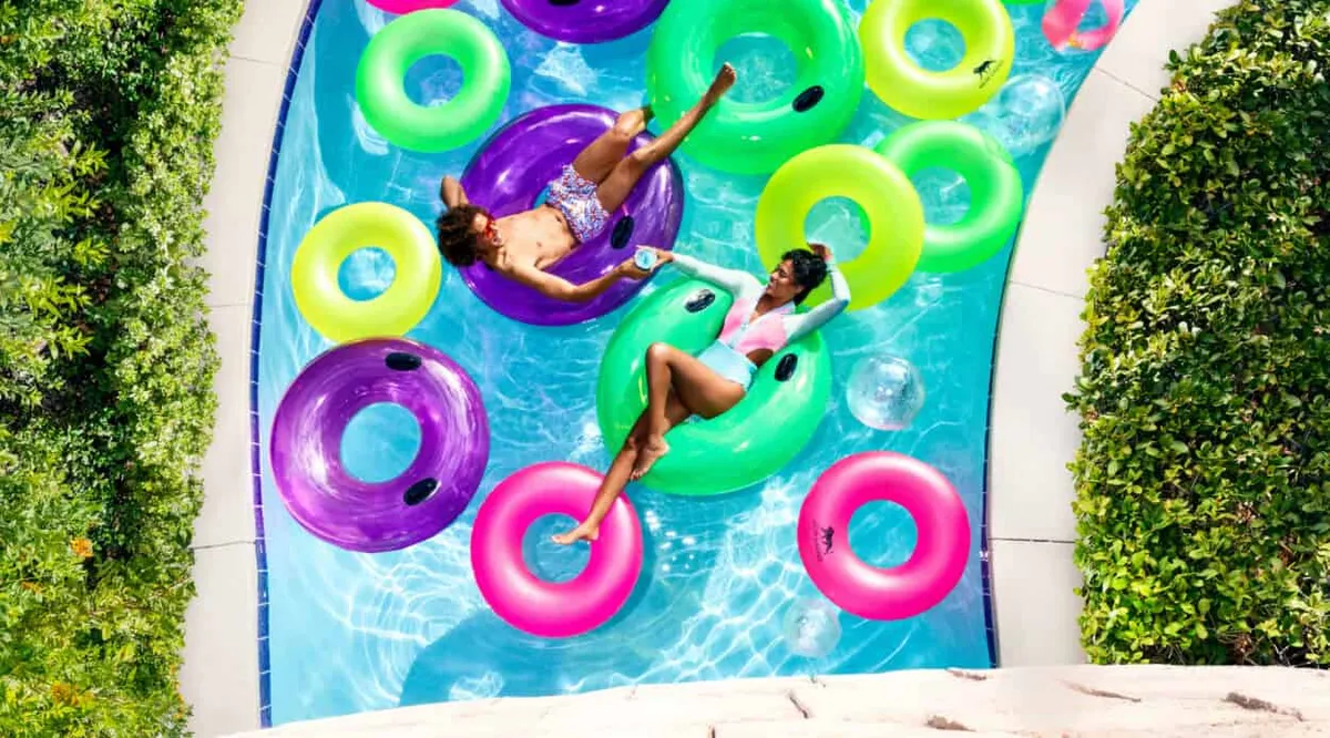 Couple on Pool Floats on Lazy River