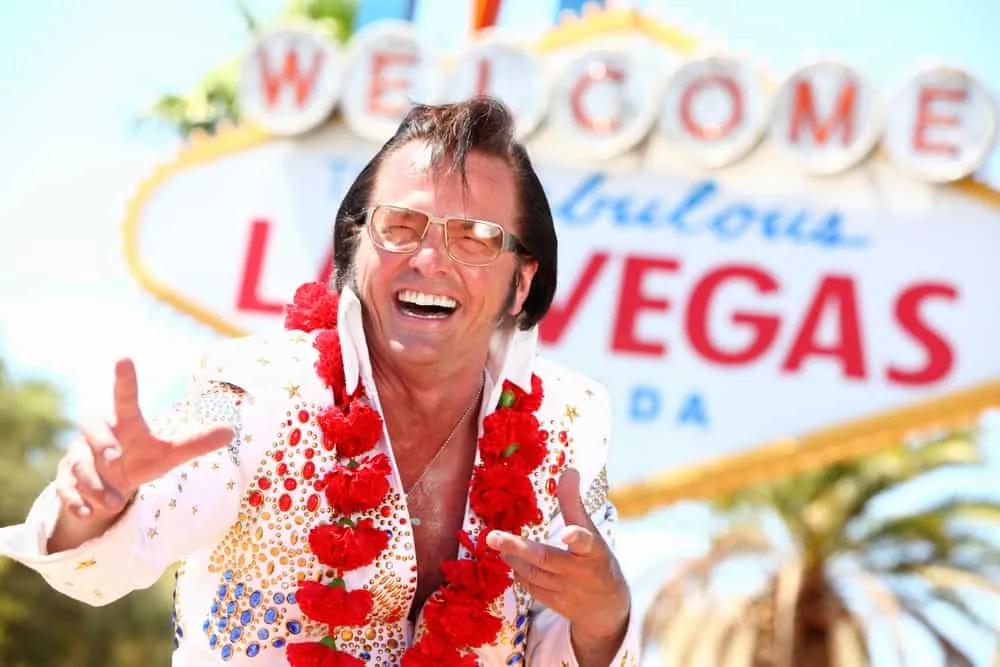 Elvis impersonator at the Welcome to Las Vegas sign