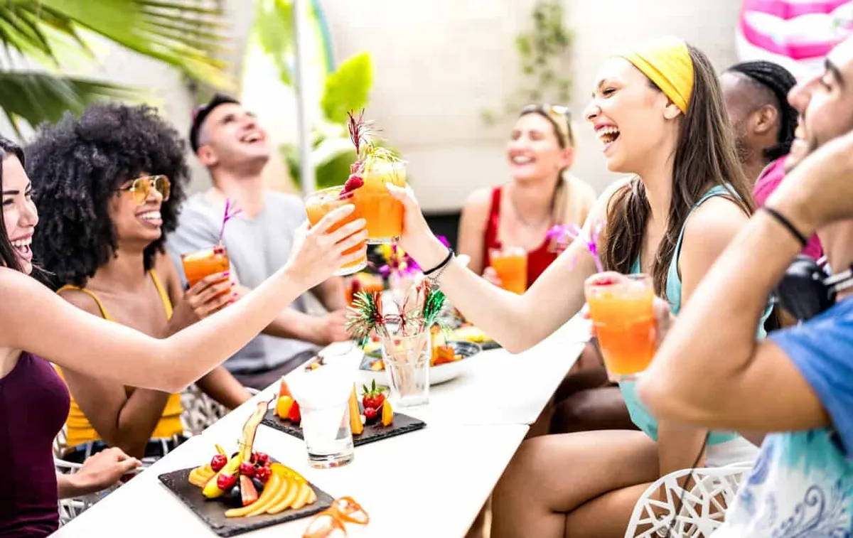 Spring Break in Las Vegas with friends toasting with cocktails and food
